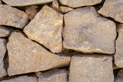 Ancient stone blocks wall close up abstract texture background Stock Photos