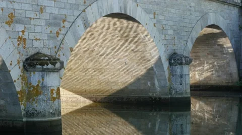 Ancient  stone bridge reflection in river surface 4K 2160p 30fps UltraHD foot Stock Footage 67612720