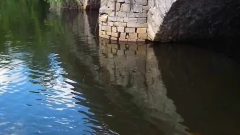 Ancient stone bridge on the river close up Stock Footage 92613643
