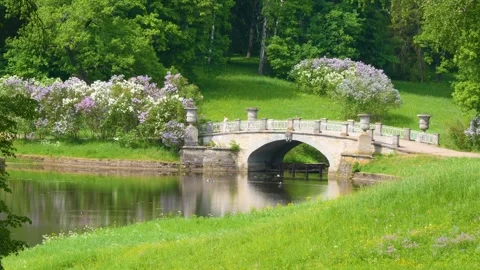 An ancient stone bridge in the spring park Stock-Footage 278750703