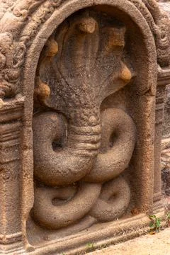 Ancient Stone Carving of a Multi-Headed Naga Cobra Guardian Stock Photos