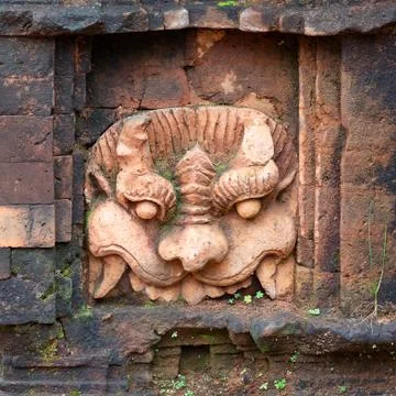 Ancient stone carving on the wall of temple in My Son Sanctuary Stock Photos