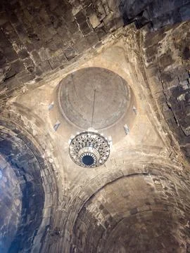 Ancient stone cathedral ceiling with central dome and decorative pattern Stock Photos