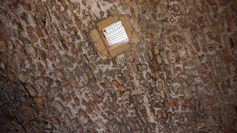 Ancient stone ceiling with iron grate window at Ajloun Castle Stock Photos