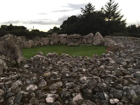 Ancient Stone Circle Surrounded by Lush Greenery at Dusk Stock Photos