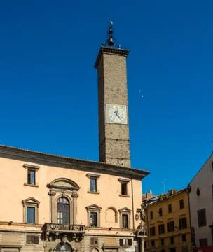 Ancient stone clock tower in the public square in the old town of Viterbo, It Stock Photos