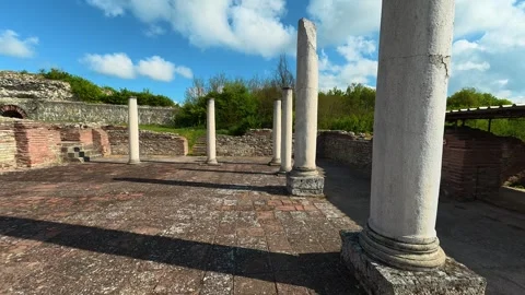 Ancient stone columns stand tall . Felix Romuliana, Imperial Palace of Galerius. Stock Footage 335293356