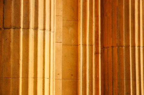 Ancient Stone Columns with Vertical Grooves and Timeless Elegance 스톡 사진