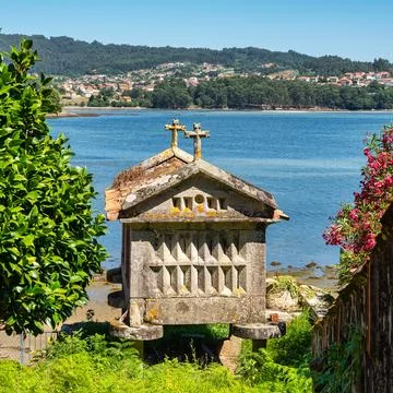 Ancient stone constructions to store the grain of the harvest, called Horreo  Stock Photos