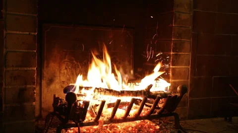 In an ancient stone fireplace fire burns Stock Footage 42971761