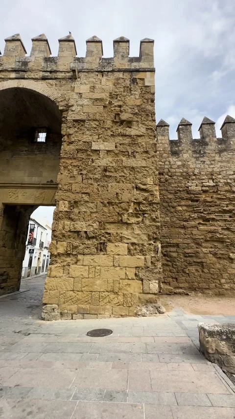 Ancient stone fortress wall with a gate in the historic city of Cordoba Stock Footage 337226650