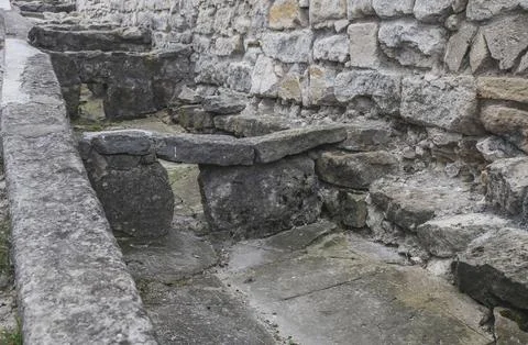 Ancient stone gutter with rapids in the castle Stock Photos