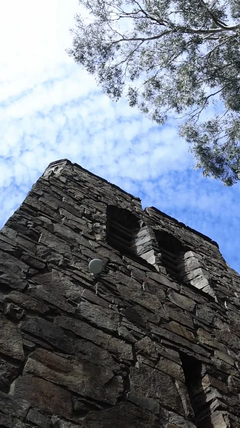 Ancient stone medieval tower against blue sky Stock Footage 341906398