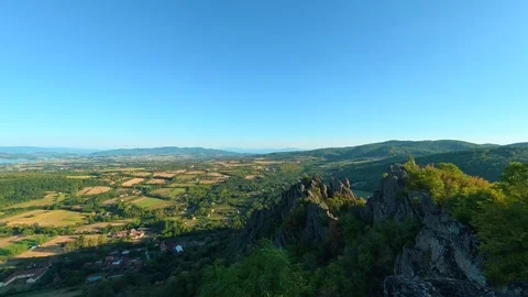 Ancient stone overlooks vast green valley. Boracki krs Serbia 動画素材 345005014