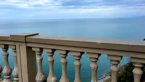 An ancient stone parapet overlooking the sea and clouds Stock Footage 330114977
