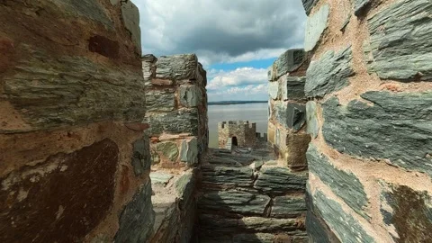 Ancient stone path leads to distant castle walls. Ram Fortress, Serbia Видео 332543958