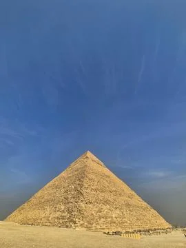 Ancient stone pyramid under clear blue sky Фото
