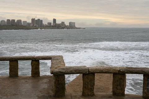 Ancient stone railing frames the sea view Stock Photos