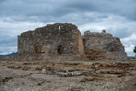 Ancient stone ruins under a cloudy sky from the Archaeological Park Recpolis Stock Photos