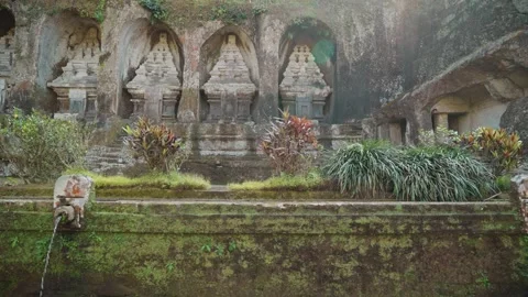 Ancient stone shrines rock carvings at Gunung Kawi Temple Bali Indonesia 動画素材 342841978