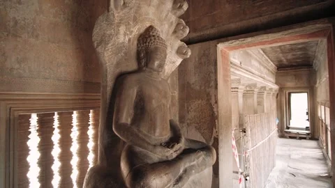 Ancient stone statue of buddha inside angkor wat temple complex in cambodia Stock Footage 325371020