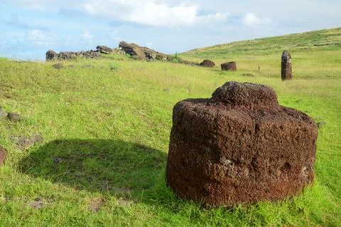 Ancient stone structures with pukao hat on Easter Island's landscape Stock Photos