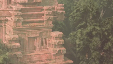 Ancient stone temple surrounded by trees in a forest setting Stock Footage 345062812