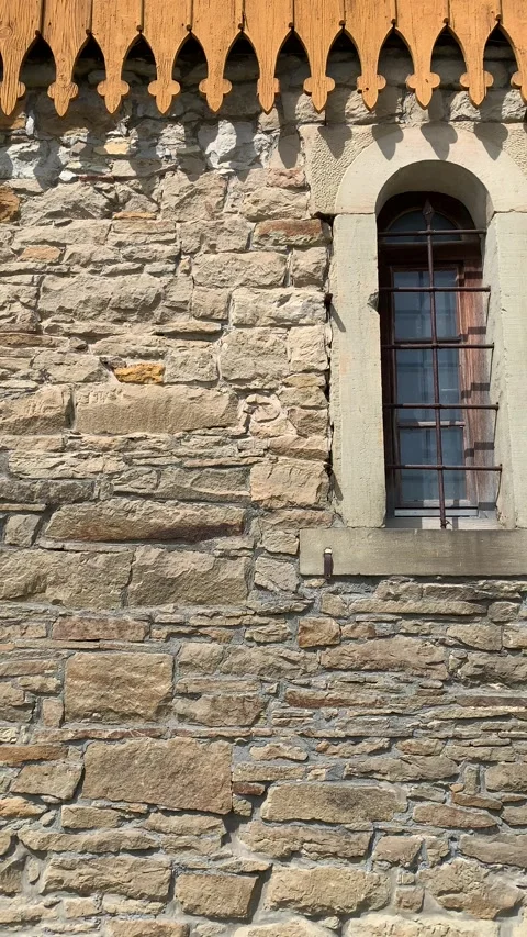 Ancient stone tower with arched window in historic village Stock Footage 319769497