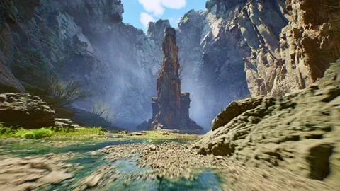 Ancient Stone Tower Monolith Standing in a Mistful Deep Rock Canyon Gorge with 스톡 동영상 332409621