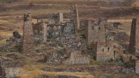 Ancient Stone Tower Ruins in Mountain Valley Vídeos de archivo 327494909