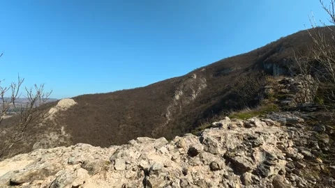 Ancient stone tower stands alone, weathered, tall. Mount Ozren Vidéo 330959563