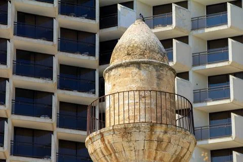 Ancient Stone Towered Structure with Modern Building Background, Tiberias, .. Stock Photos