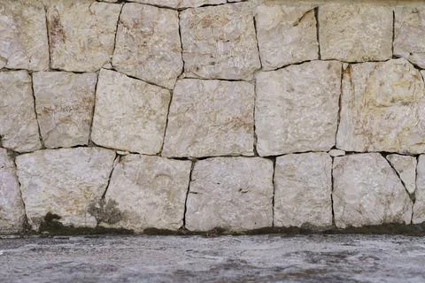 Ancient stone wall background. Old texture stonework material of ancient Stock Photos