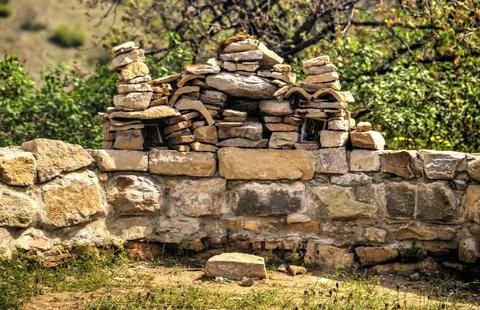 An ancient stone wall with built stone proskinitarium Stock Photos