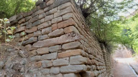 Ancient Stone Wall Corner With Weathered Embedded Wooden Structural Timber 스톡 사진