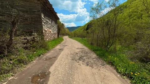 Ancient stone wall lines one side. Near Tupavica Waterfall, Serbia Vídeos de archivo 335532201