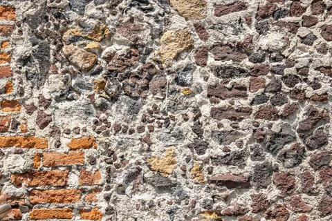 Ancient stone wall with mixed bricks and mortar Fotos de archivo