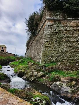 Ancient Stone Wall by Mountain Stream Stock Photos