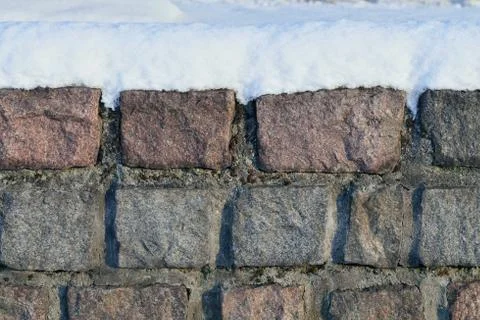 Ancient stone wall in the snow Stock Photos
