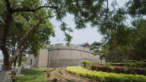 Ancient Stone wall of Wanping City in Beijing surrounded by flowers Stock Footage 274176712