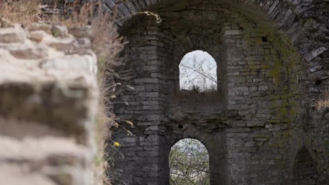 Ancient stone walls and arched window openings of Gjirokastër Castle in Albania Stock Footage 345363648