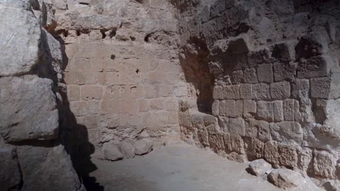 Ancient stone walls inside archaeological ruins with natural light and shadow Stock Footage 337638905