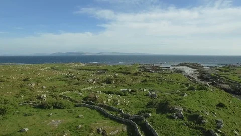 Ancient stone walls lace the landscape and seaside, Ireland Stock Footage 84272553