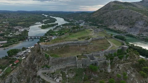 Ancient stone walls of Rozafa Castle on mountain in Scodra in Albania, aerial Stock-Footage 305163570