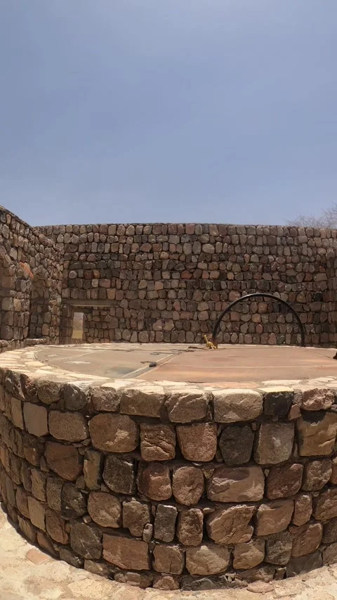 Ancient Stone Well Ruins and Walled Courtyard Stock Footage 346194495