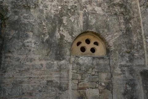 Ancient Stone Window with Decorative Ventilation Holes in Demre, Turkey, Refl Stock Photos