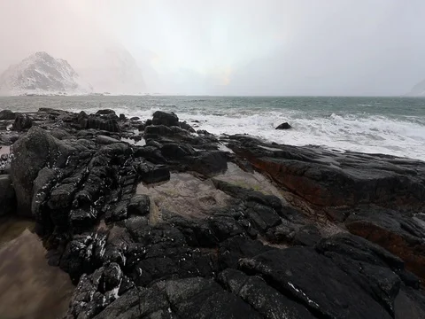 Ancient stones on the shores of cold Norwegian Sea at evening time. Stock Footage