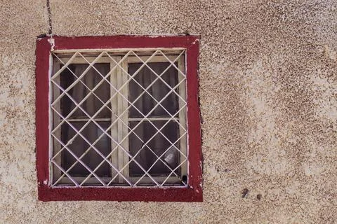 Ancient structure and old, red painted window Stock Photos