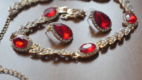 Ancient style necklace and earrings on the table Stock Footage