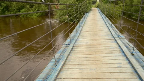 Ancient suspension bridge, tarn structure gives a sense of adventure Video stock 314943711